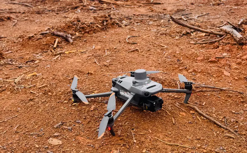 Dragonfly drone on red earth at an interior site in Guyana